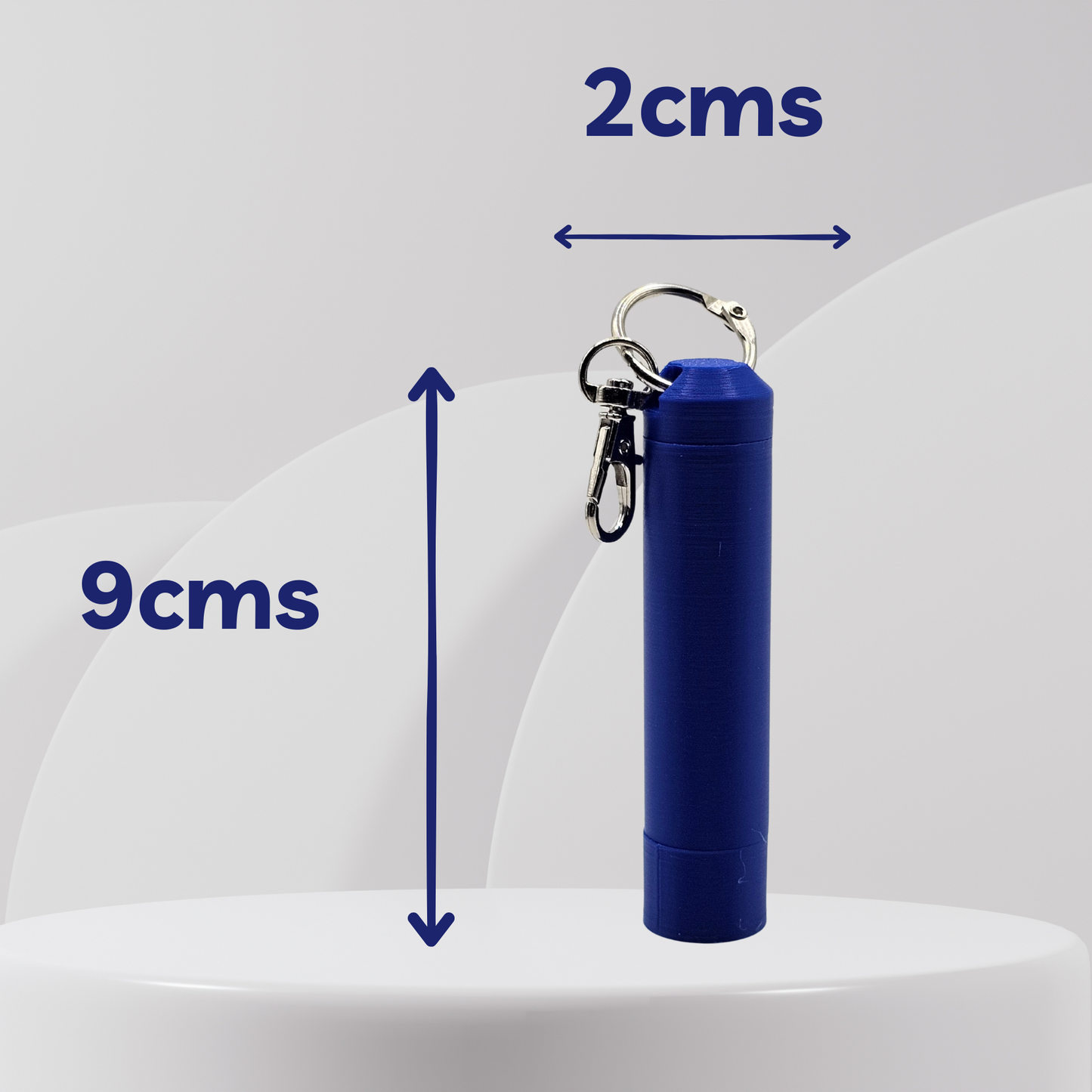 Blue cylindrical container with a keychain on a white background, showing measurements.