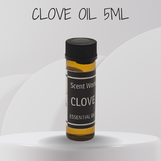 Bottle of Scent World Clove essential oil on a white background