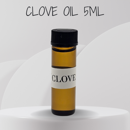Small bottle of clove oil with a black cap on a white background