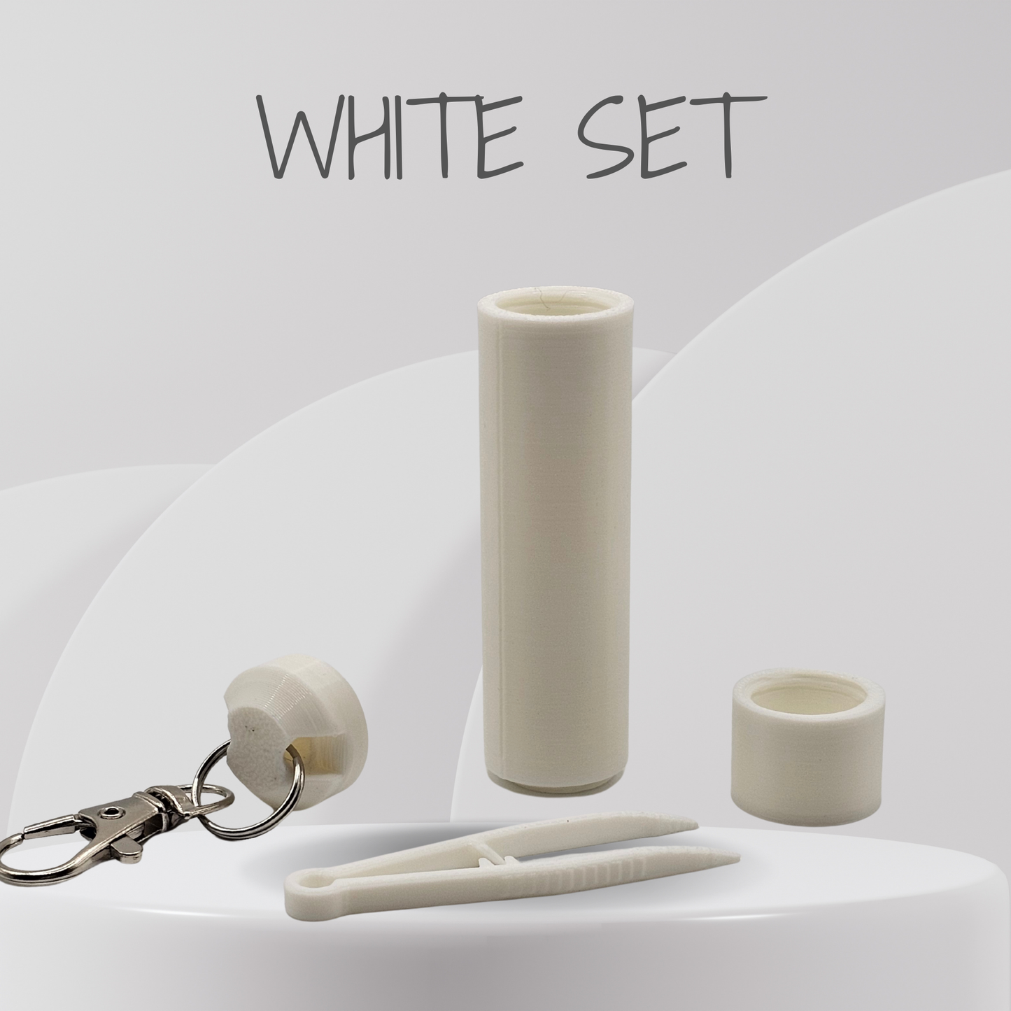 White cylindrical object, keychain, and clips on a white background with 'WHITE SET' text.