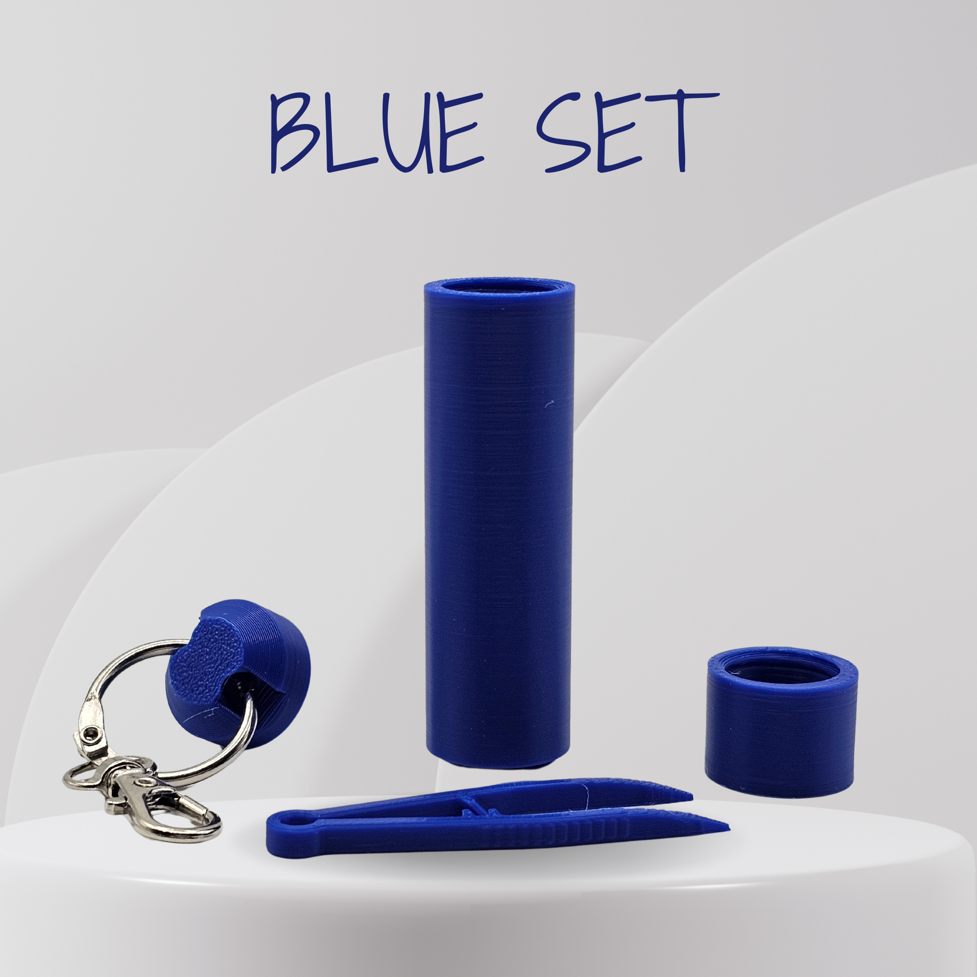 Blue silicone set including a clip, keychain, and cylindrical item on a white background with 'BLUE SET' text.
