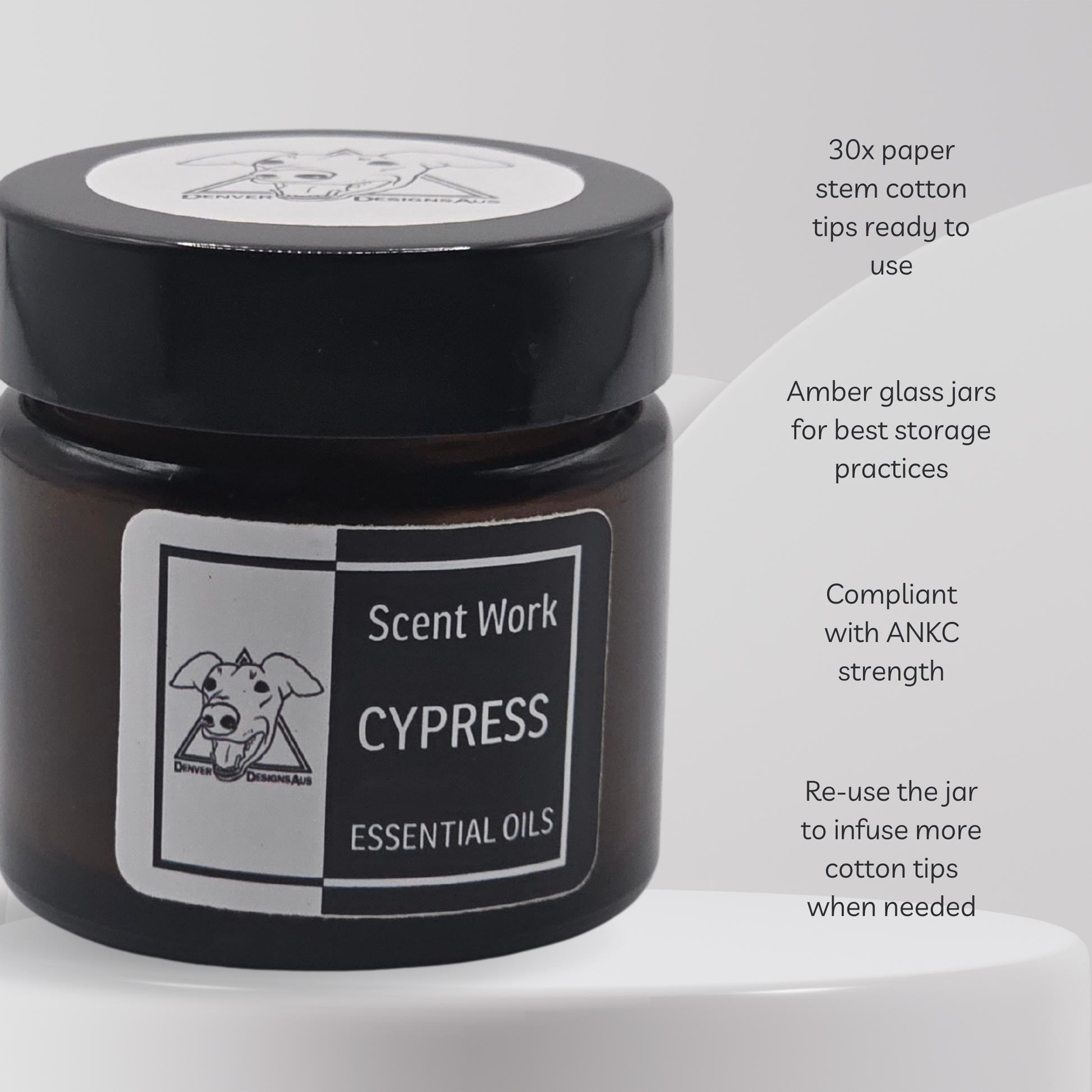Black jar of Cypress essential oils with a label on a white background