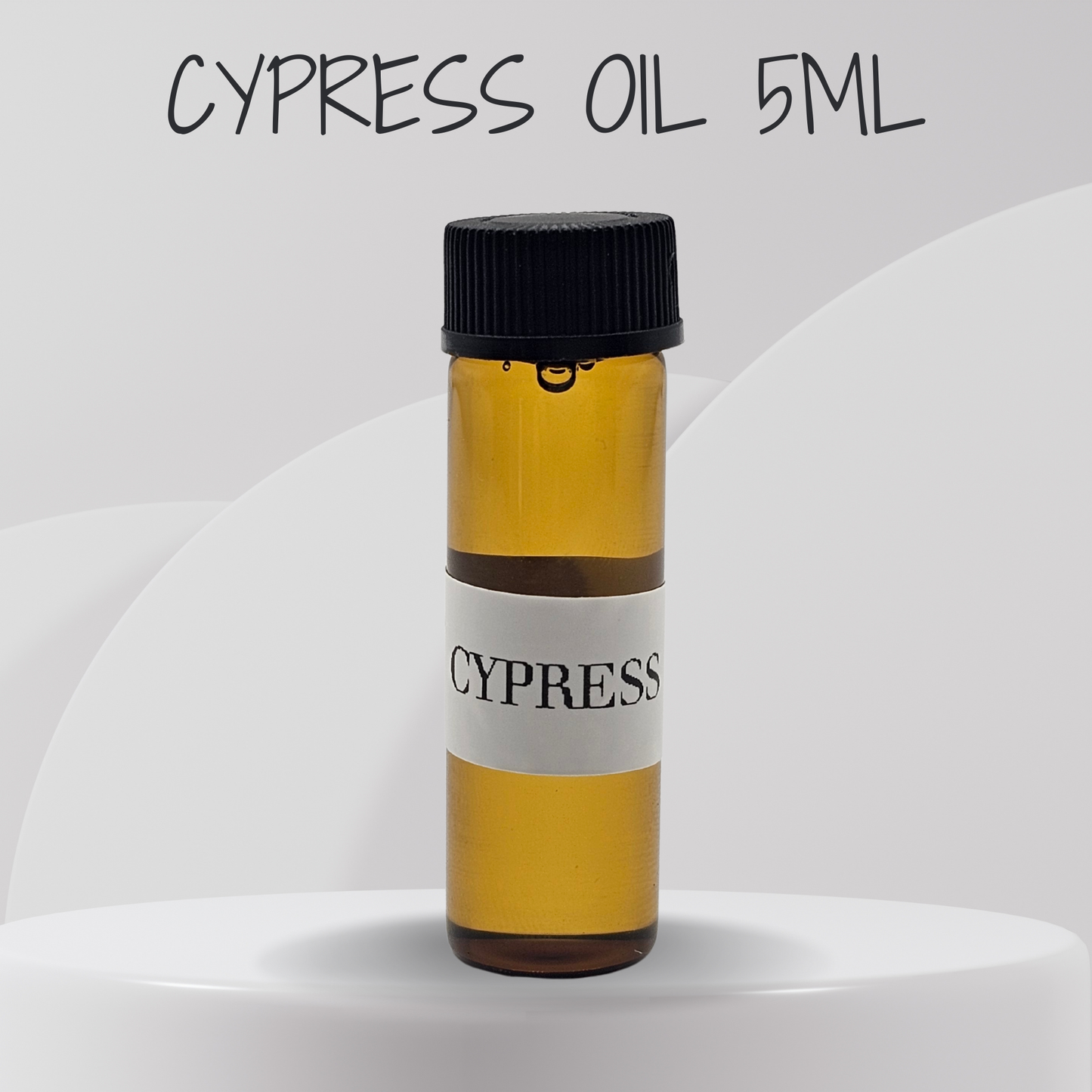Bottle of cypress oil with a black cap on a white background