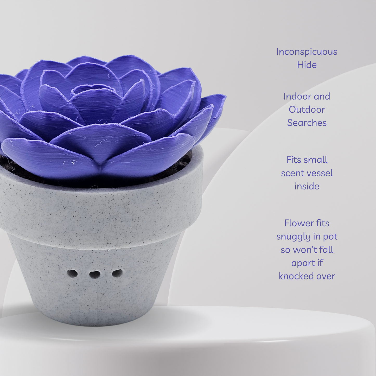 Purple flower-shaped diffuser in a gray pot on a white background