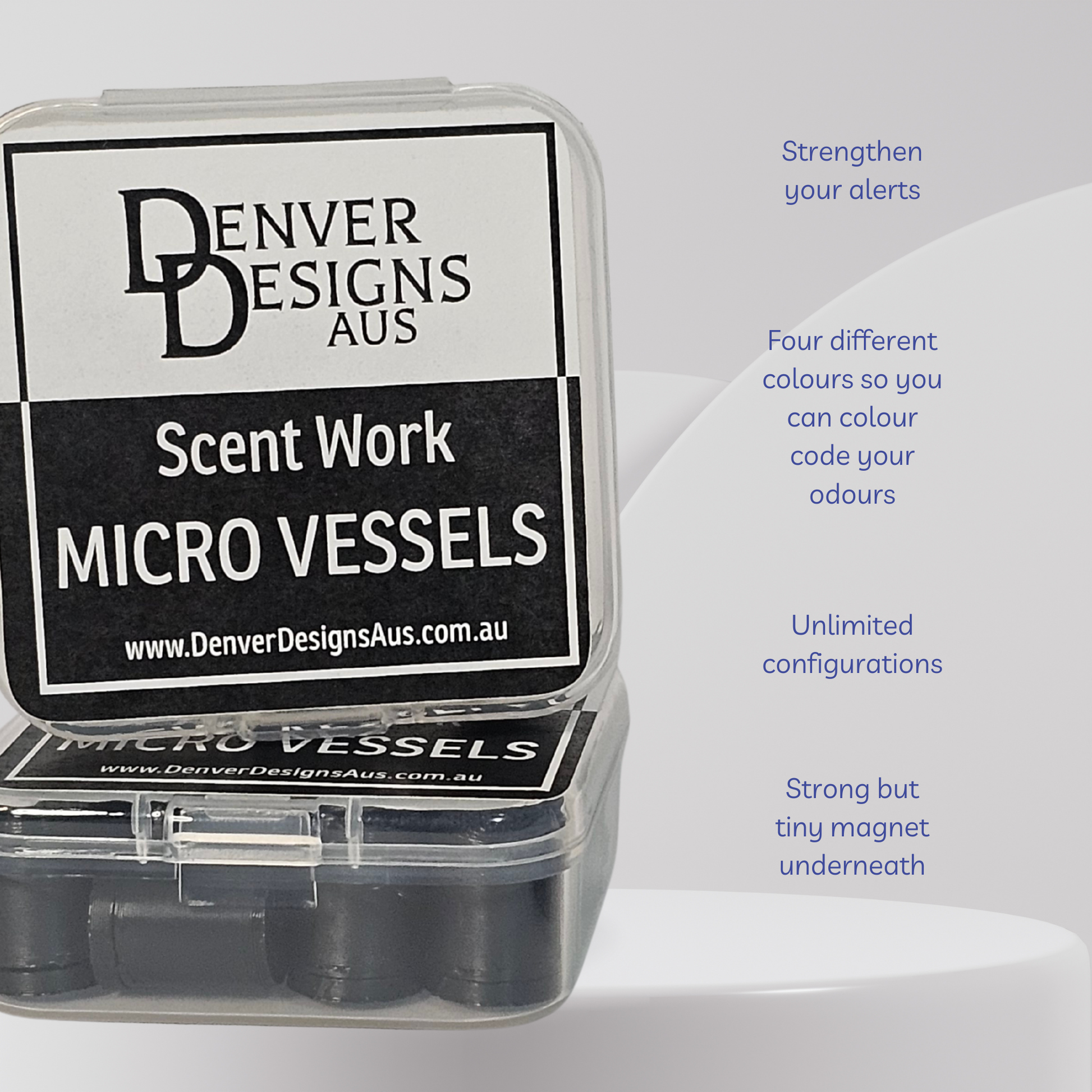 A clear plastic case containing black circular micro vessels, with a large black-and-white label reading 'Denver Designs Aus Scent Work Micro Vessels.' Blue text on the right lists features such as strengthening alerts, four different colors, unlimited configurations, and a strong but tiny magnet underneath.