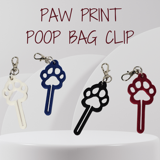 Four paw print shaped poop bag clips in white, blue, black, and red, displayed on a white pedestal with the text 'PAW PRINT POOP BAG CLIP' at the top.