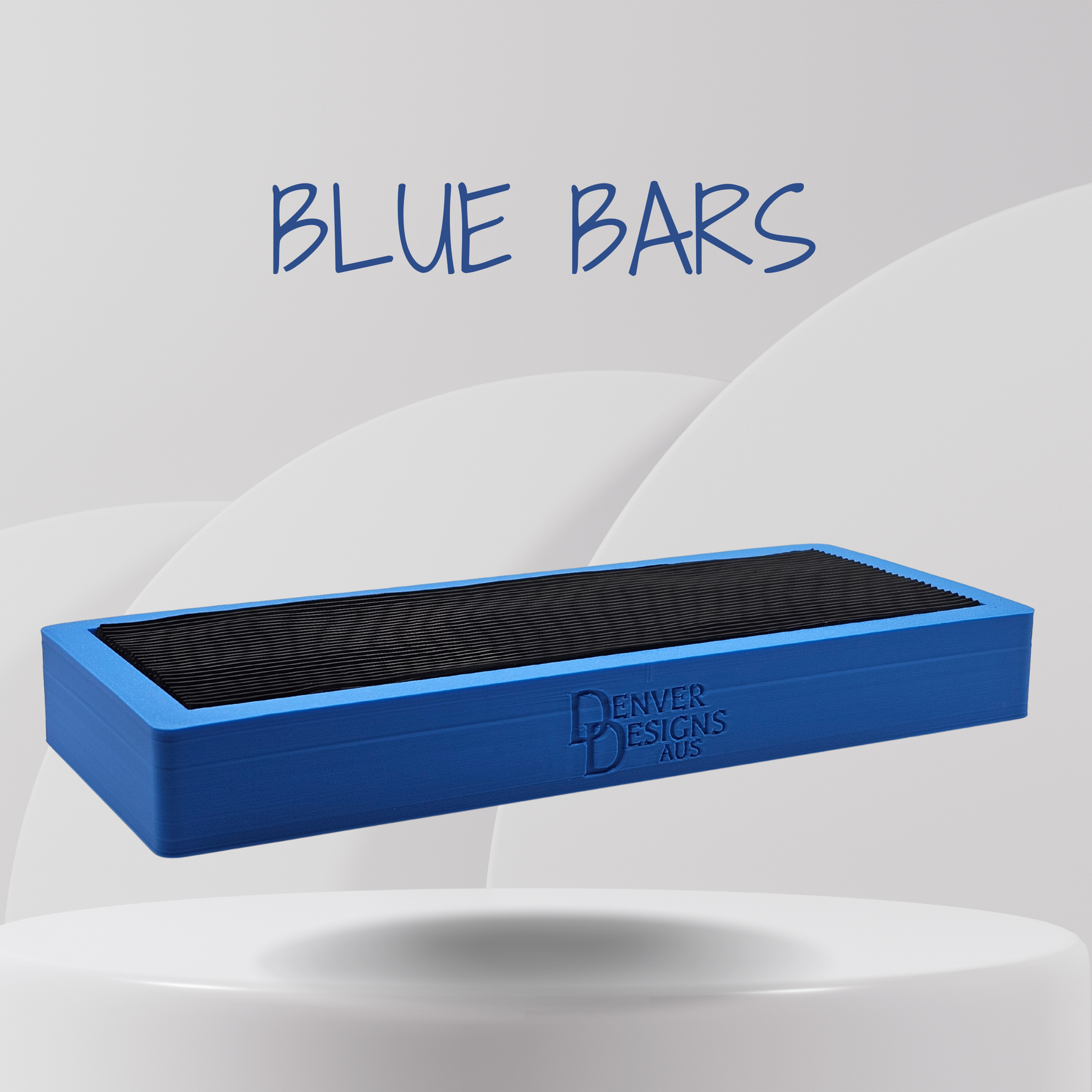 Blue bar with black rubber top on a white platform, branded 'Denver Designs Plus'.