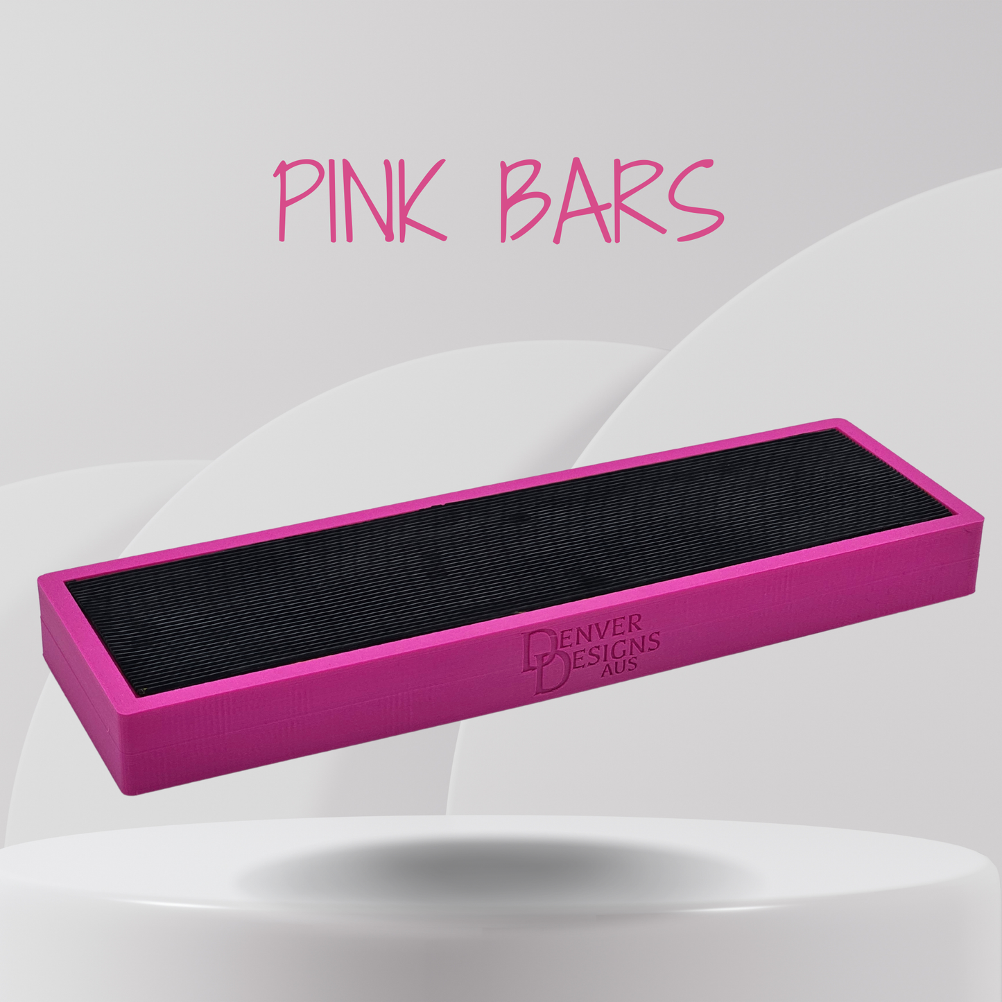 Pink position bar with black rubber surface on a white background, branded 'Denver Designs'.