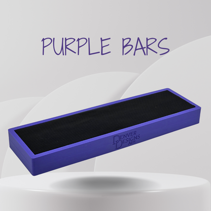 Purple bar with black rubber top on a white platform, branded 'Denver Designs', against a light gray background.