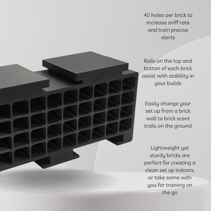 Black plastic sniff rate training bricks shown at an angle with descriptive text overlays on the right detailing their features, such as 40 holes per brick and stability rails.