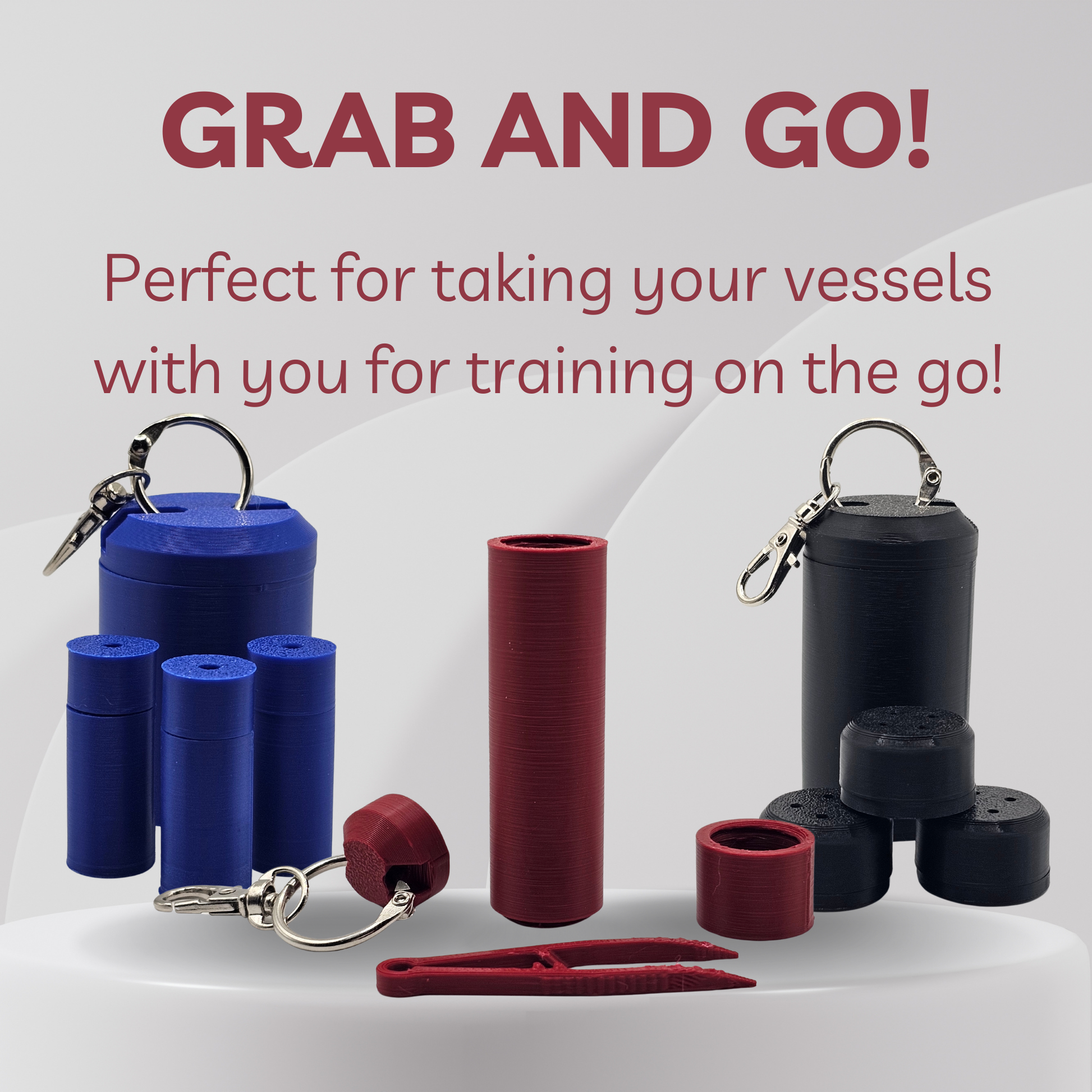 A set of portable vessel storage containers and accessories shown on a clean light gray background with promotional text reading 'GRAB AND GO!'. The set includes blue and black cylindrical vials with metal clips, red cylindrical pieces, a small red heart-shaped piece, and a red folding clamp.