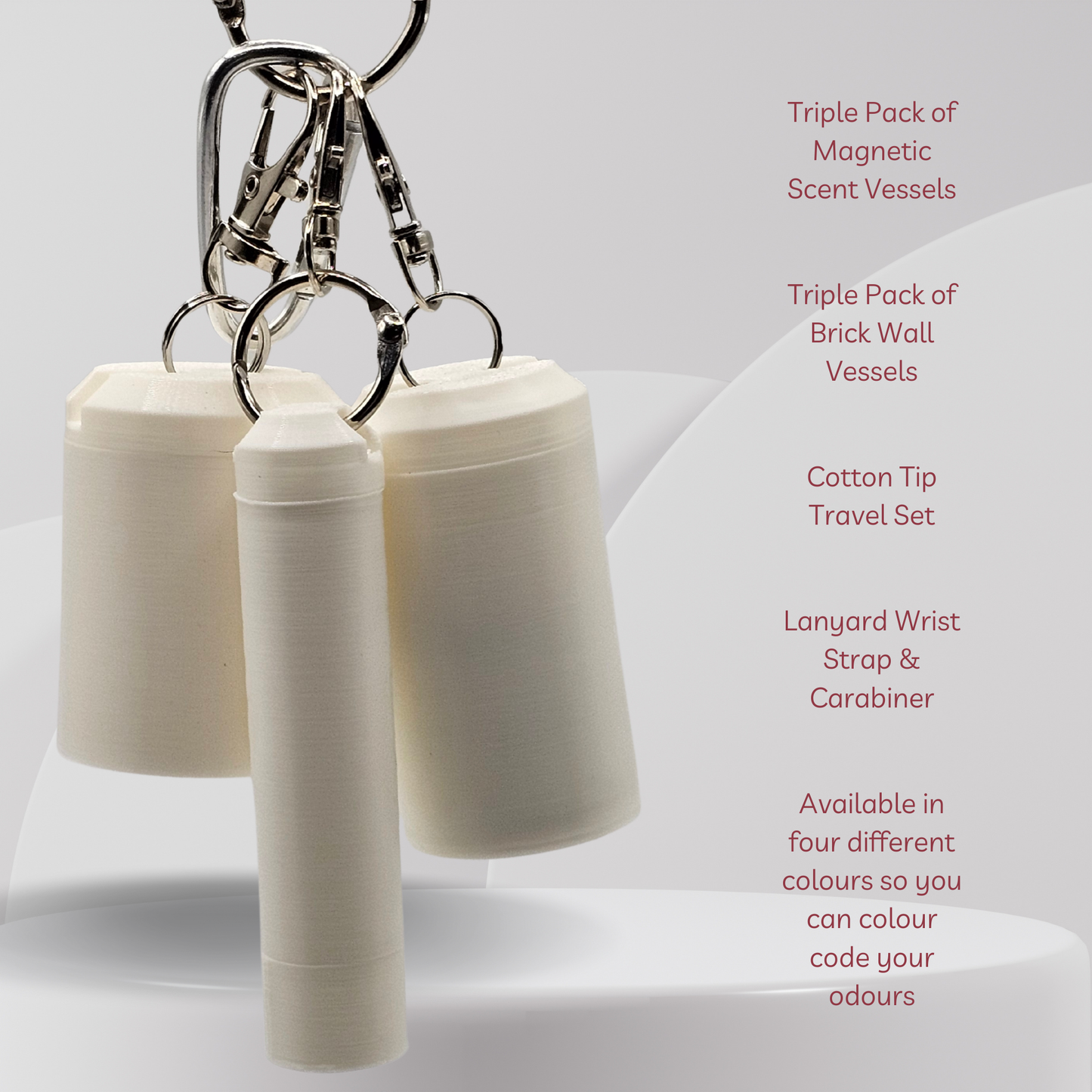 Three small cylindrical travel containers with screw-top lids and metal clips, shown on a white studio background with descriptive text along the right side.