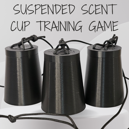 Three black 3D-printed cone-shaped cups hanging from black cords, with the text 'SUSPENDED SCENT CUP TRAINING GAME' above them on a light gray background.
