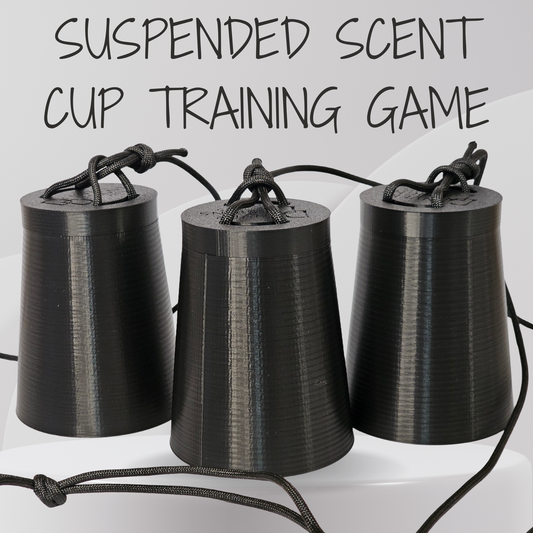 Three black 3D-printed cone-shaped cups hanging from black cords, with the text 'SUSPENDED SCENT CUP TRAINING GAME' above them on a light gray background.